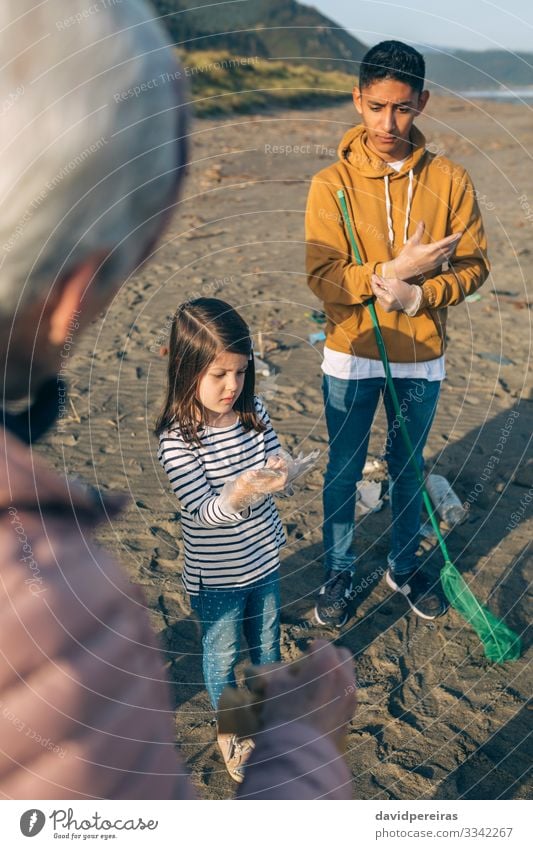 Volunteers preparing to clean the beach Happy Beautiful Beach Child Human being Boy (child) Woman Adults Man Family & Relations Group Environment Sand Old Dirty