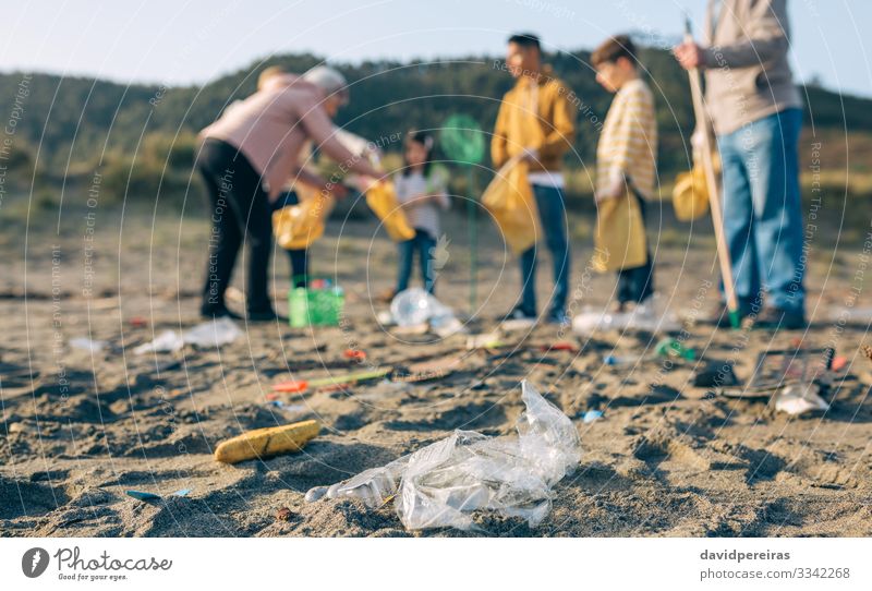 Plastics in the beach with group of volunteers Beach Child Human being Boy (child) Woman Adults Man Group Environment Sand Gloves Old Dirty Clean