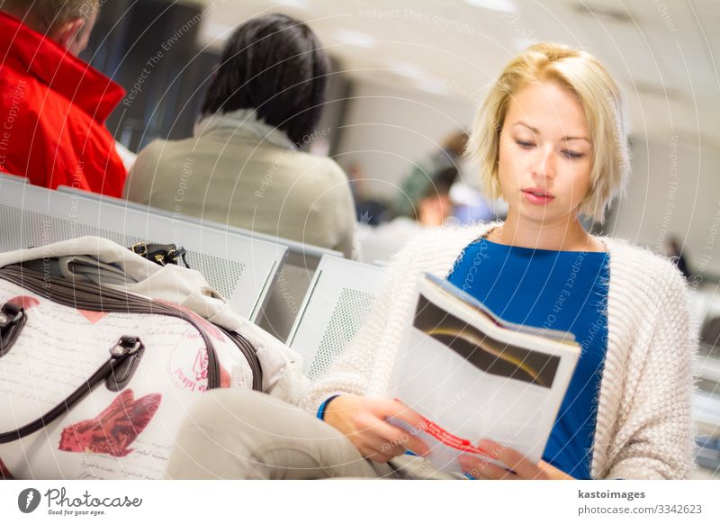 Woman reading a magazine while waiting. Beautiful Leisure and hobbies Reading Vacation & Travel Tourism Trip Aviation Human being Adults Newspaper Magazine