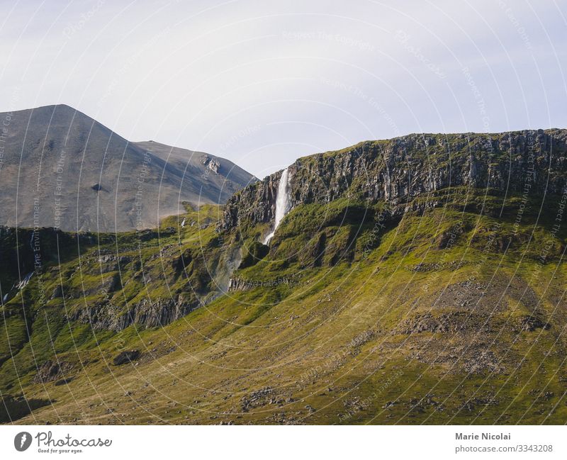 Skógafoss waterfall in Iceland during summer Environment Nature Landscape Elements Earth Water Drops of water Cloudless sky Summer Beautiful weather Grass Rock