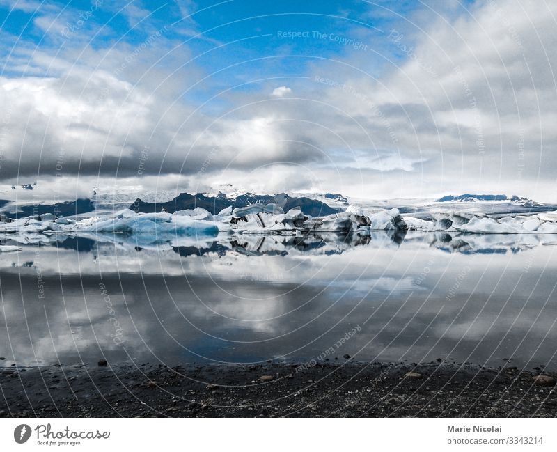 Jokulsarlon ice lake in Iceland Environment Nature Landscape Elements Earth Sand Water Clouds Summer Winter Beautiful weather Frost Snow Glacier Lakeside