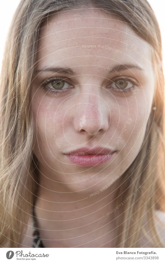 close up portrait of a beautiful young woman at sunset Portrait photograph Youth (Young adults) Woman Exterior shot Happy Blonde blue eyes Bridge Summer Sunbeam