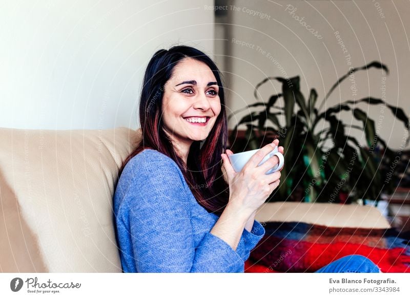 young caucasian woman having coffee or tea at home for breakfast at home. Close up view Life Resting Lifestyle Leisure and hobbies Interior shot Human being