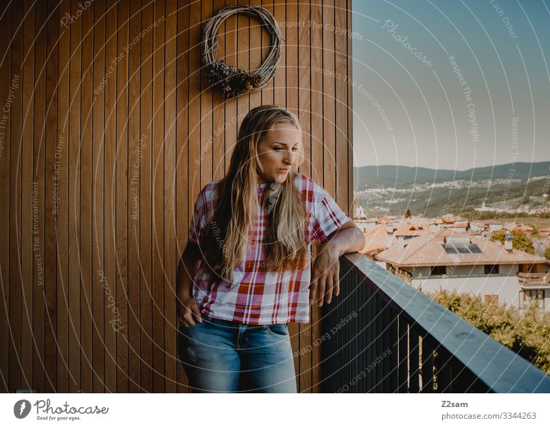Young woman in Italy Vacation mood Balcony country country house Southern Warm light Summer Summer vacation Blonde Woman pretty Girl youthful Meditative jeans