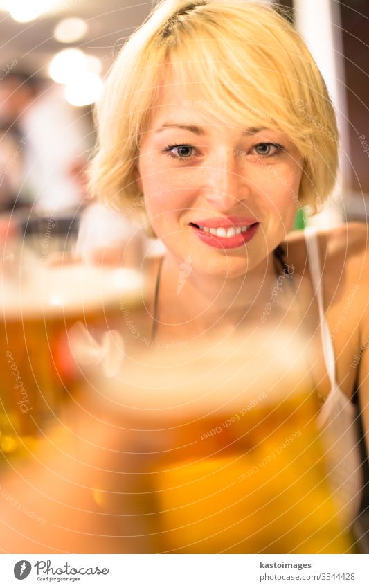 Lady toasting with a pint of beer. Beverage Alcoholic drinks Beer Lifestyle Joy Relaxation Leisure and hobbies Night life Flirt Feasts & Celebrations