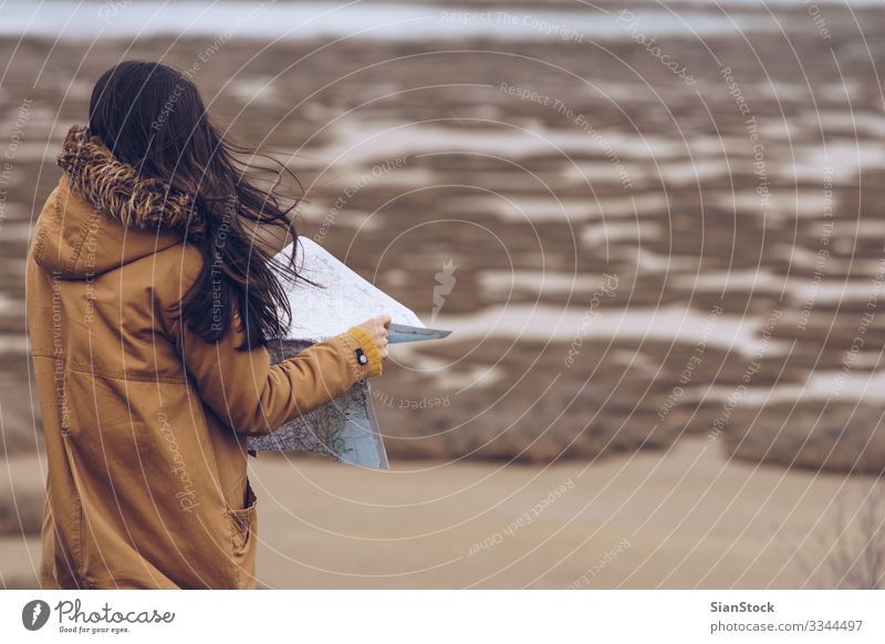 Woman reading a map next to a river, Greece. Beautiful Relaxation Leisure and hobbies Adventure Ocean Winter Hiking Human being Adults Hand Nature Wind Coast