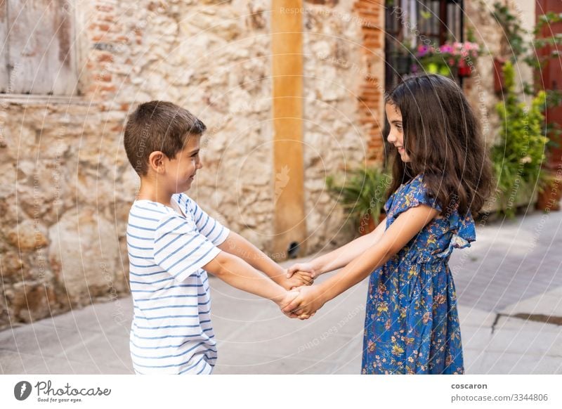 Two children holding hands on a spring day Lifestyle Joy Happy Beautiful Vacation & Travel Summer Summer vacation Child Human being Masculine Feminine Toddler