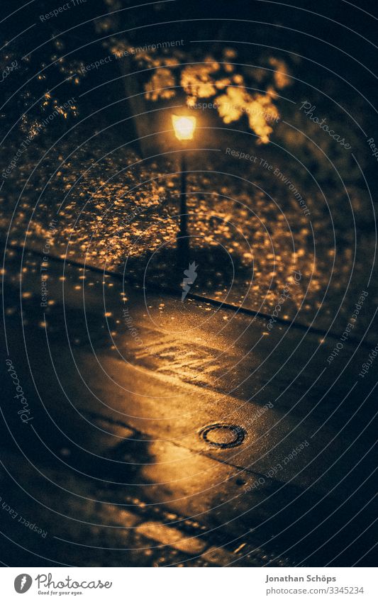 Streetlight at night in autumn from bird's eye view streetlamp Night Autumn Rain conceit somber Bird's-eye view Lantern foliage Light Lamp Exterior shot