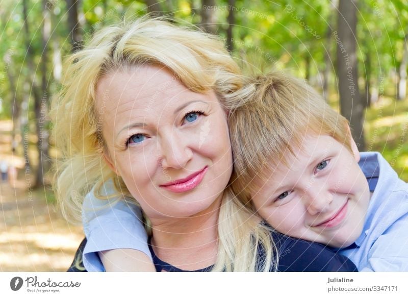 Portrait of mother and son Child Schoolchild Boy (child) Woman Adults Man Infancy 18 - 30 years Youth (Young adults) Nature Autumn Blonde White girl Caucasian
