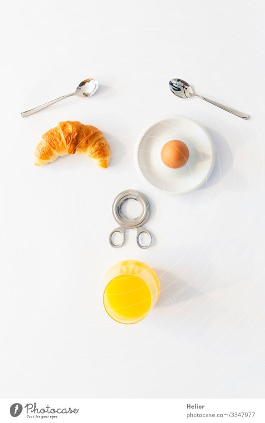 Funny breakfast concept with an abstract human face Croissant Beverage Juice Plate Spoon Joy Well-being Relaxation Eating Androgynous Face Glass Metal Drinking