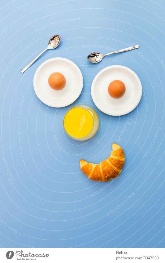 Funny breakfast concept with an abstract human face Croissant Breakfast Beverage Juice Plate Spoon Joy Relaxation Eating Androgynous Face Smiling Looking