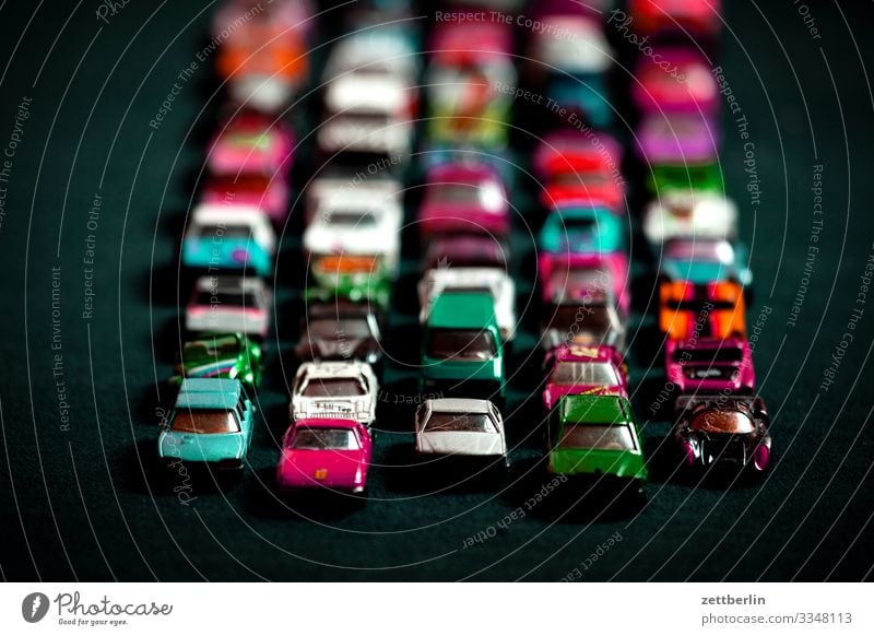 Toy jam Car Driving mass Crowd of people Replication Row Toys Model car Toy car Tracks Traffic jam Stand Street Road traffic Speed Transport Many Full Crowded