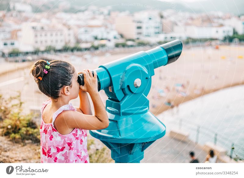 Girl looking the beach through a telescope Lifestyle Happy Leisure and hobbies Vacation & Travel Tourism Far-off places Sightseeing Beach Ocean Child