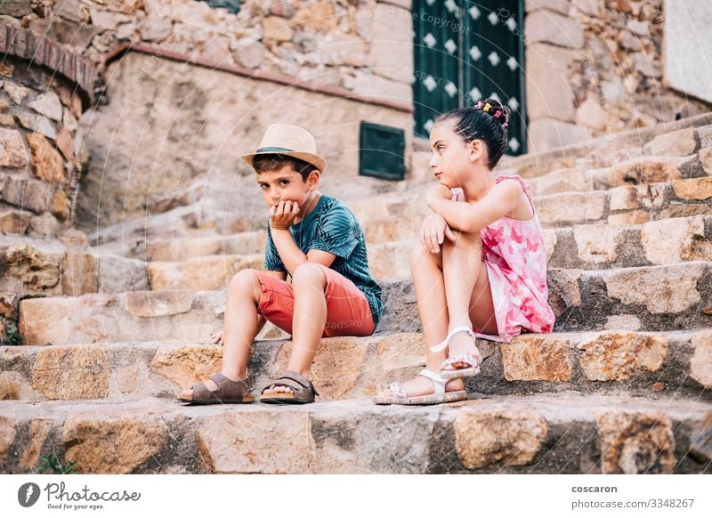 Two bored children sitting on a stairs on a summer day Lifestyle Face Leisure and hobbies Vacation & Travel Summer Summer vacation Garden Child Human being
