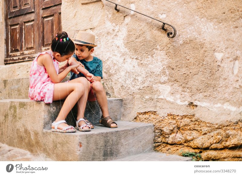 Girl healing a boy a wound in a summer day Lifestyle Beautiful Skin Health care Medical treatment Illness Leisure and hobbies Playing Vacation & Travel Tourism