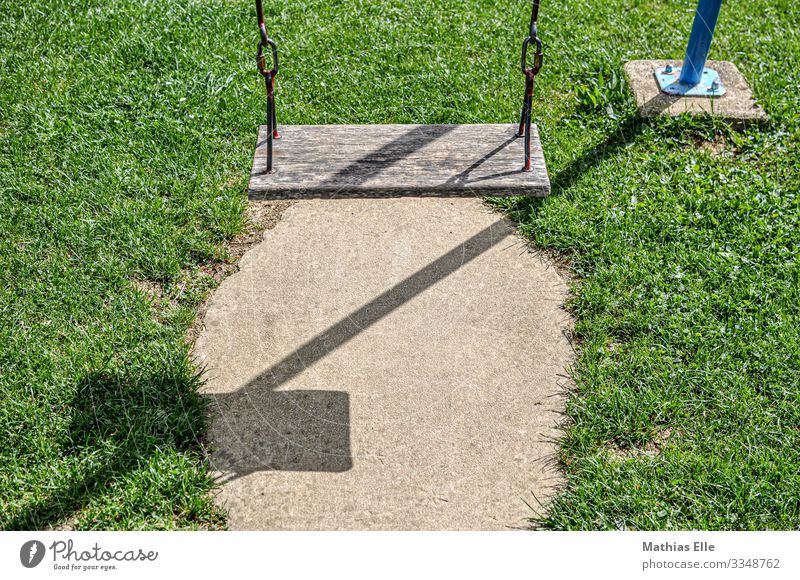 Swing on playground wood Metal Brown green Playground To swing Shadow Meadow Playing Kindergarten Leisure and hobbies Vacation & Travel Infancy Childhood memory