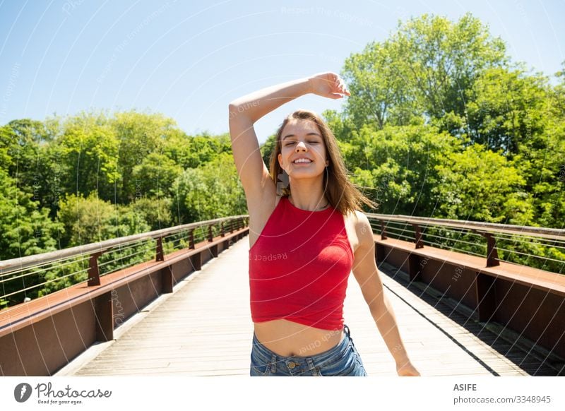 Happy and beautiful young woman enjoying the sun in a park Lifestyle Joy Beautiful Relaxation Leisure and hobbies Summer Sun Woman Adults Youth (Young adults)