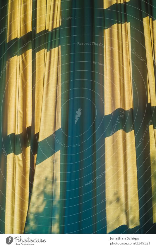 Curtain with shadow from window Drape Window Shadow Green Yellow Window transom and mullion Shadow play Pattern background crease Sunlight sun protection warm