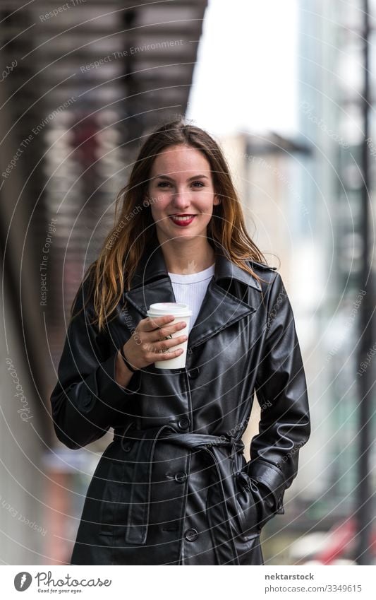 Portrait of Young Woman Holding Paper Coffee Cup Outdoors Lifestyle Beautiful Adults Youth (Young adults) Street Coat Leather Happiness Emotions