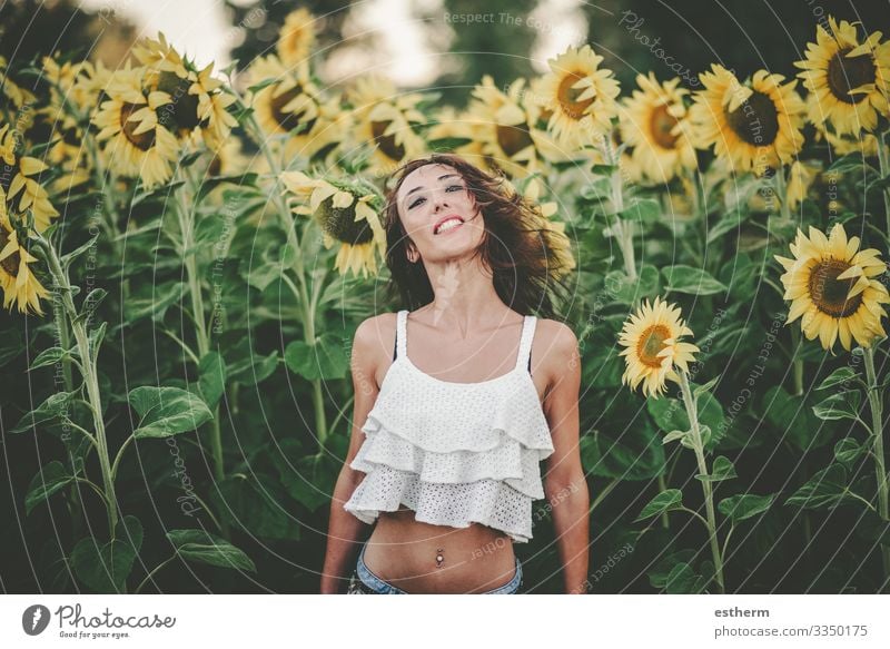 Young Woman in Sunflower Field Lifestyle Joy Beautiful Wellness Vacation & Travel Freedom Summer Summer vacation Human being Feminine Young woman
