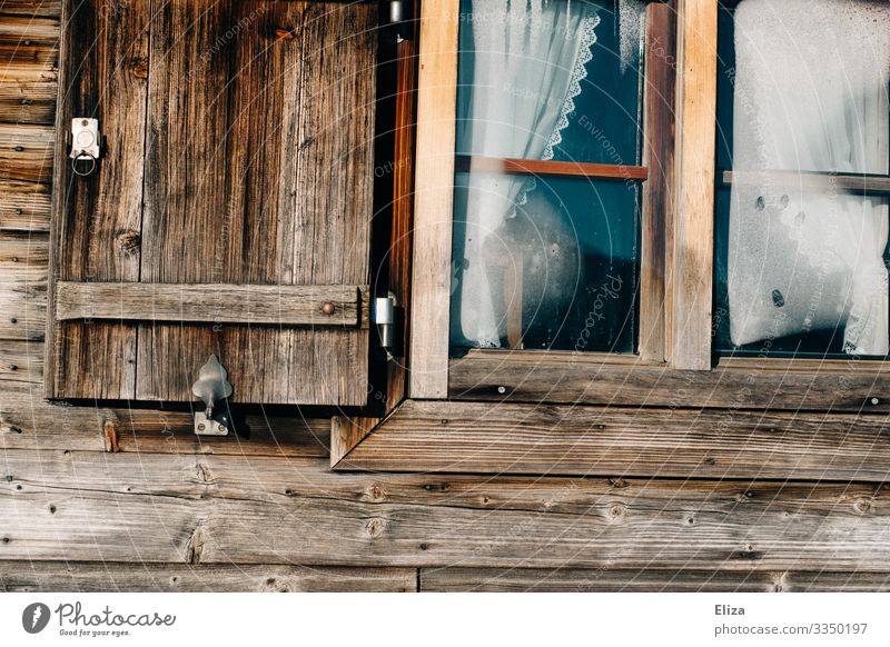 Window of a wooden hut Wooden hut Rustic hut magic Rural Old Hut Detail Facade Wooden house Shutter