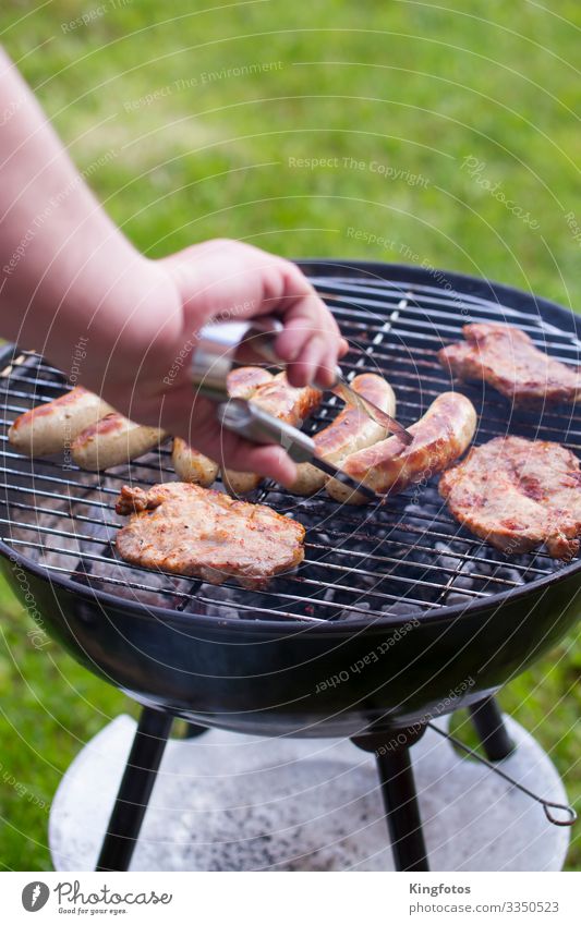 at the barbecue Meat Sausage Nutrition Picnic Bratwurst Steak Pork Pork tenderloin Beef Camping Summer Garden Arm Hand Barbecue (apparatus) Metal To enjoy