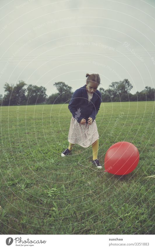 girl with a red balloon in a meadow Child Infancy Meadow Balloon Playing Old fashioned Retro Exterior shot Grass Environment Field Joy Landscape Dress