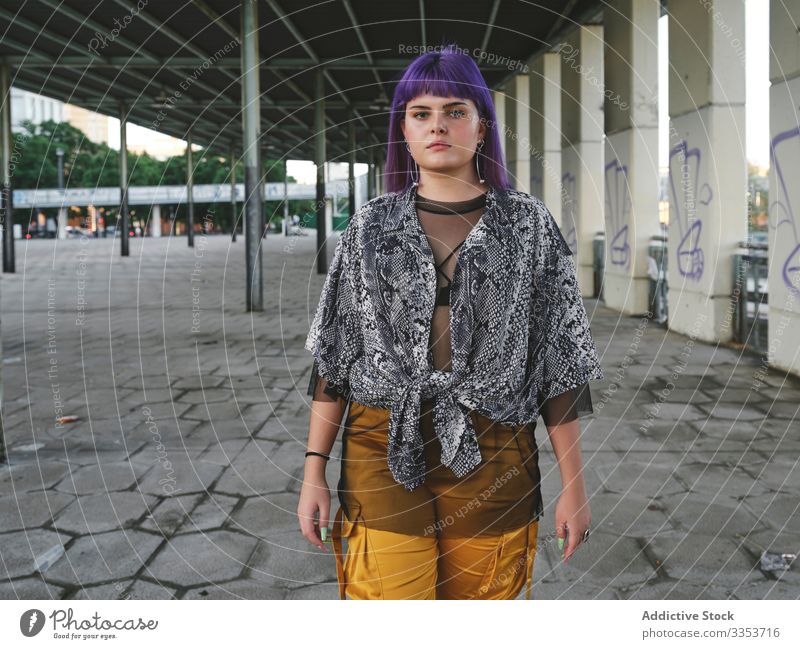 Female hipster in colorful sportswear in countryside - a Royalty Free Stock  Photo from Photocase