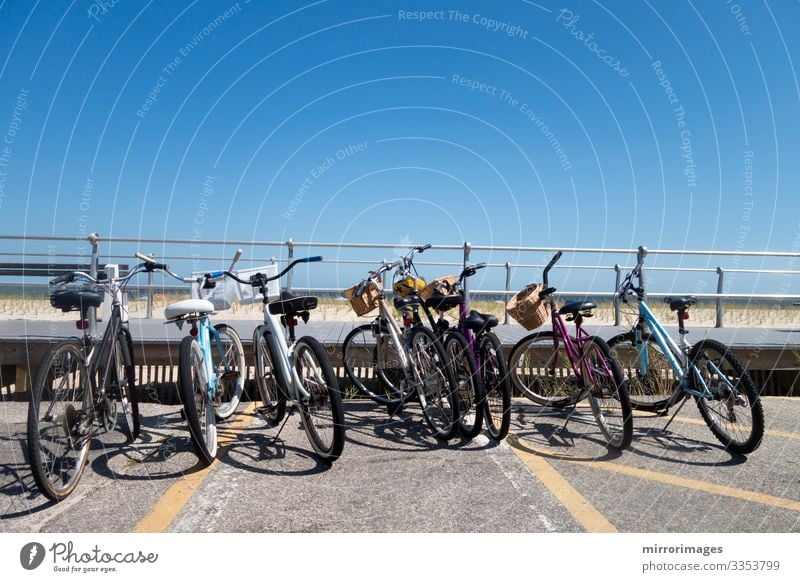 row or parked bikes at a beach boardwalk sea shoreline Beautiful Leisure and hobbies Vacation & Travel Tourism Summer Beach Ocean Fitness Sports Training