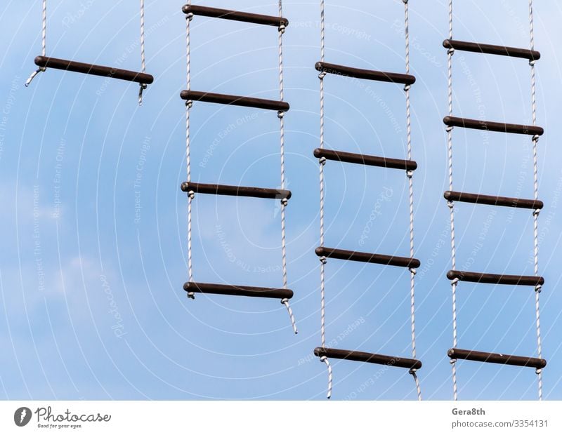 rope ladder against a blue sky and clouds Climbing Mountaineering Rope Sky Clouds Sphere Blue Colour abstract background crossbar empyrean ether footway get up