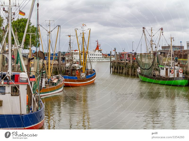 Neuharlingersiel in East Frisia Relaxation Vacation & Travel Ocean Culture Water Fishing village Harbour Ferry Fishing boat Watercraft Tradition Drop anchor
