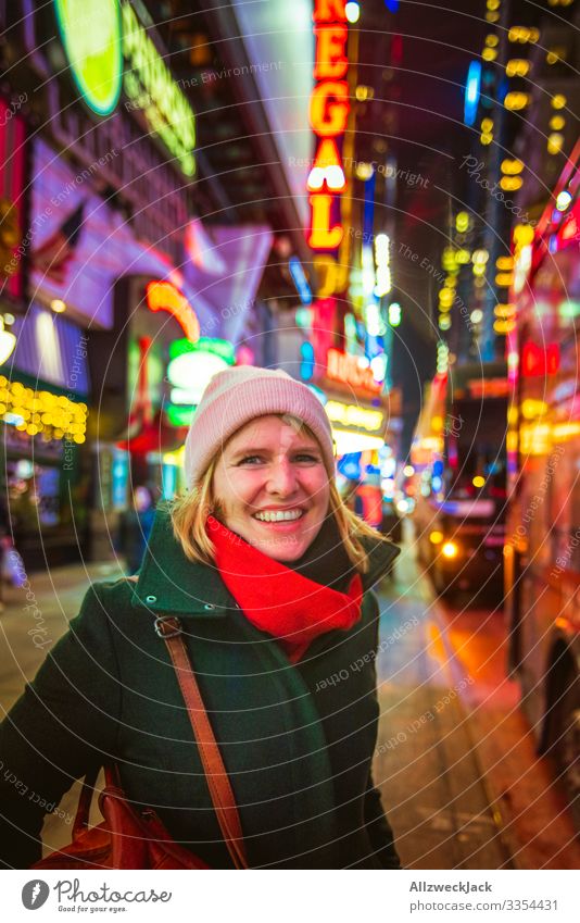 Portrait of a young woman in New York USA Americas New York City Manhattan Night shot Portrait photograph Young woman Laughter Happiness Cold Winter
