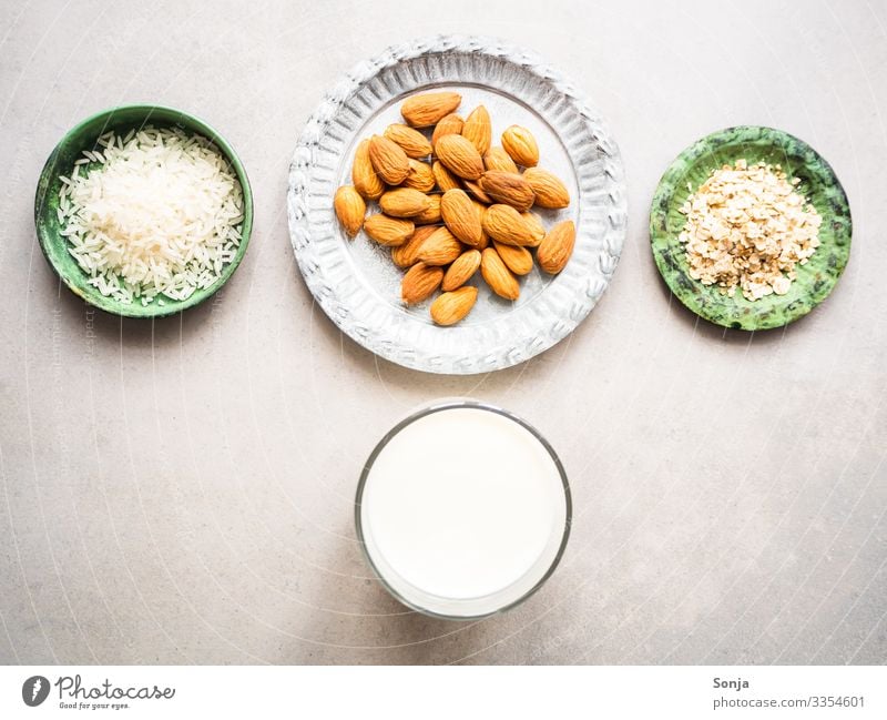 Ingredients for almond, rice and oat milk Food Dairy Products Rice Almond Oat flakes Milk almond milk Nutrition Breakfast Organic produce Vegetarian diet