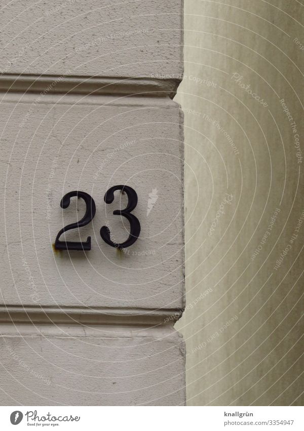 23 Town House (Residential Structure) Wall (barrier) Wall (building) House number Sign Digits and numbers Communicate Gray Black White prime Old building