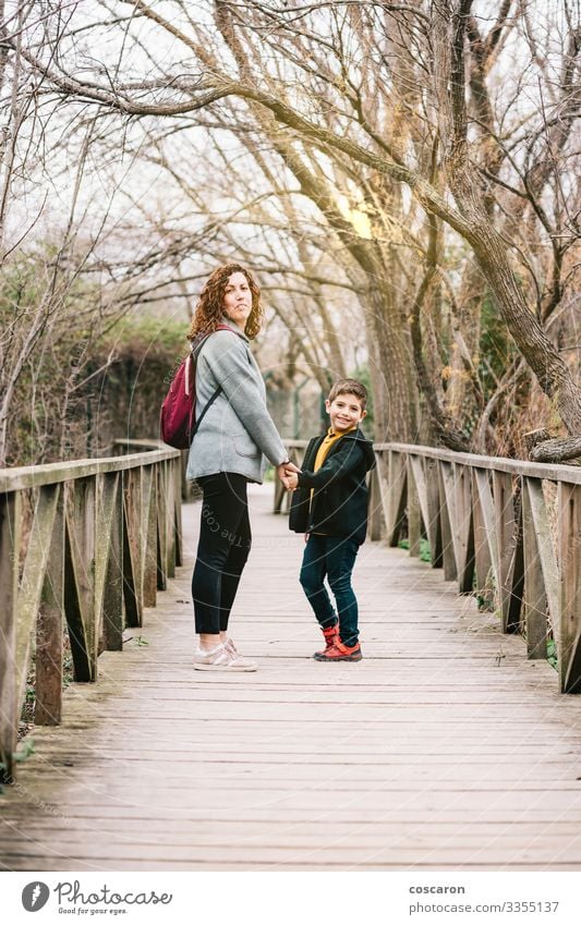 Mother and son crossing a bridge together Lifestyle Joy Happy Beautiful Healthy Leisure and hobbies Vacation & Travel Tourism Adventure Freedom Summer Mountain