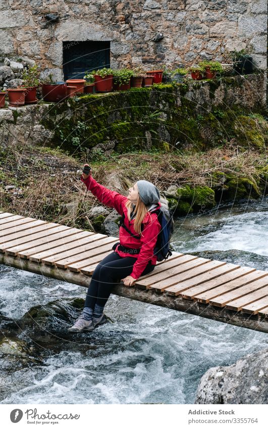 Travel Man On Bridge Over Beautiful Forest River by Stocksy Contributor  Aila Images - Stocksy