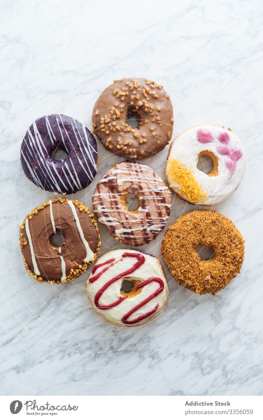 https://www.photocase.com/photos/3356059-variety-of-doughnuts-on-marble-background-variety-photocase-stock-photo-large.jpeg