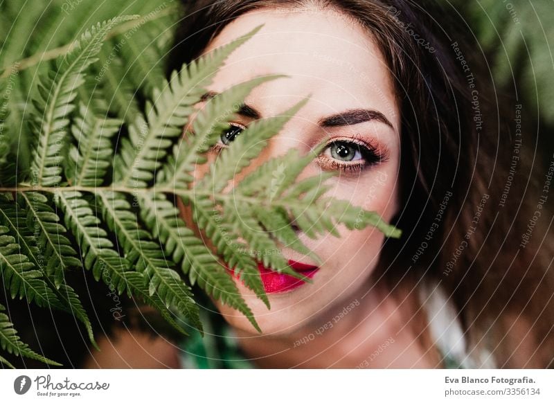 close up portrait of a young beautiful woman among green fern leaves Clean Youth (Young adults) Attractive Adults Skin care front Face Fresh Portrait photograph