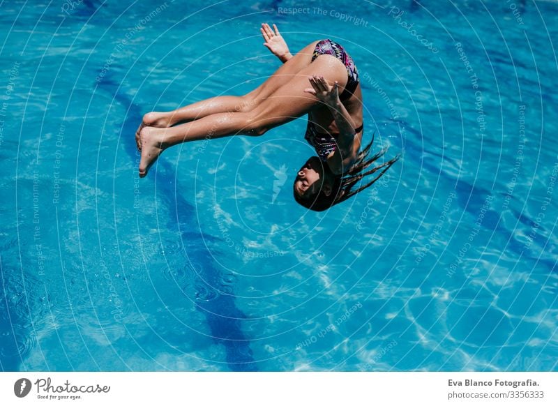 beautiful kid girl at the pool, summertime - a Royalty Free Stock