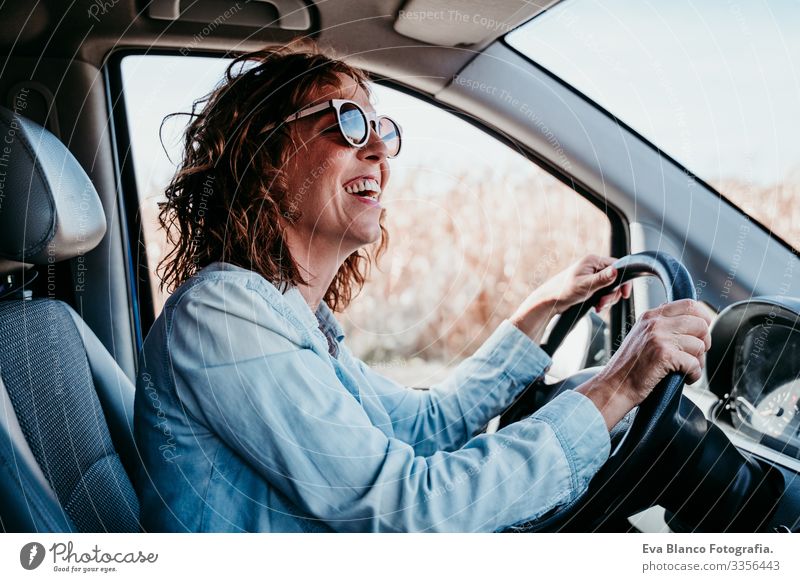 young beautiful woman driving a car. travel concept Woman Youth (Young adults) Driving Car Sunbeam Sunglasses Vacation & Travel Traveling Wheel Drive hire Share