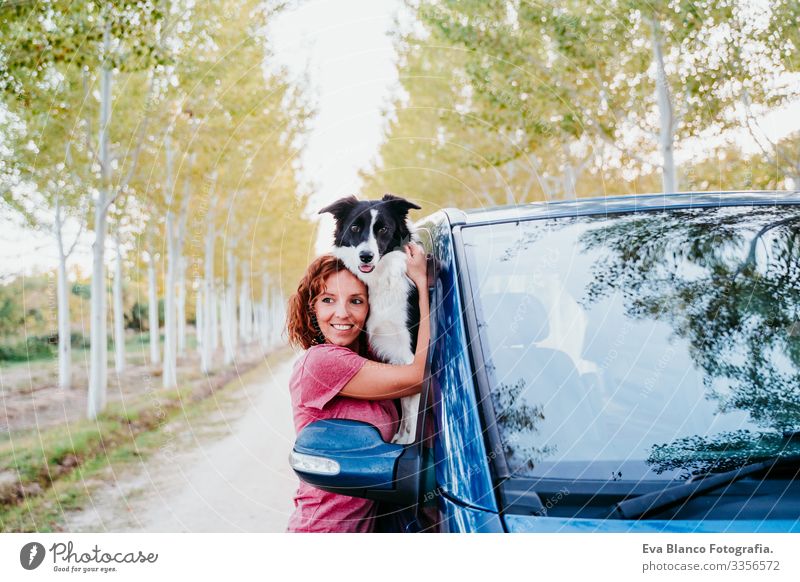 woman hugging her border collie dog in a van. Travel concept Woman Dog Van van life Vacation & Travel Traveling owner Youth (Young adults) Modern Autumn Spring