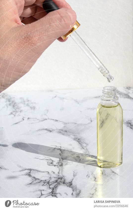 Pipette dropper of oil in glass bottle on marble Bottle Body Skin Medical treatment Medication Fragrance Spa Science & Research Laboratory Container Drop