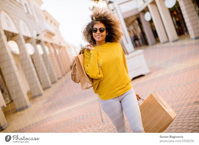 Young Black Woman With Curly Hair In Shopping A Royalty Free Stock Photo From Photocase