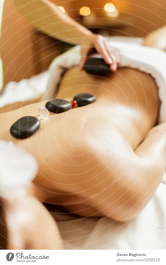 Hot stone massage therapy Lifestyle Beautiful Body Skin Medical treatment Relaxation Spa Massage Human being Young woman Youth (Young adults) Woman Adults Back