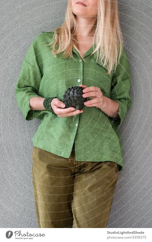 Woman in green clothes holding artichoke Beautiful Summer Human being Young woman Youth (Young adults) Adults Art Fashion Clothing Shirt Pants Jeans Blonde