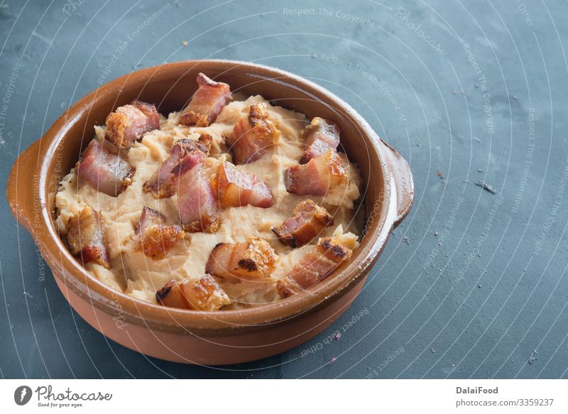 mashed potatoes with slice of bacon Food Diet isolated Potatoes spanish tapa torrezno torreznos typical spanish food white background Colour photo