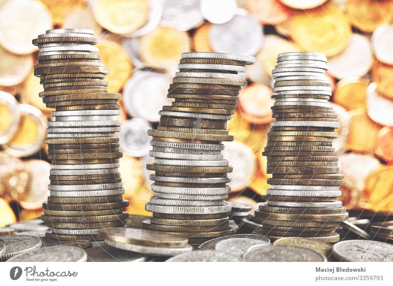 Wobbly towers made of diverse old coins. Lifestyle Shopping Luxury Happy Money Game of chance Lottery Night life Economy Financial Industry Stock market