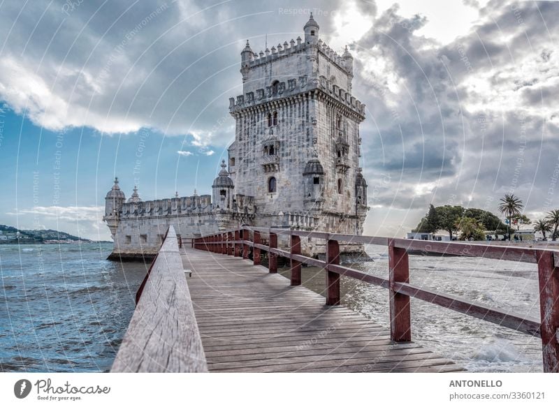 Footbridge and east side of Belem Tower in Lisbon Vacation & Travel Tourism Sightseeing City trip Architecture Water Sky Clouds Sunlight Spring Coast Ocean