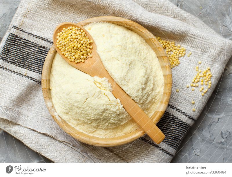 Hulled millet flour and grain in a bowl Vegetarian diet Diet Plate Bowl Spoon Cloth Healthy Flour food Millet gluten free preudocereal preudo cereal Cooking