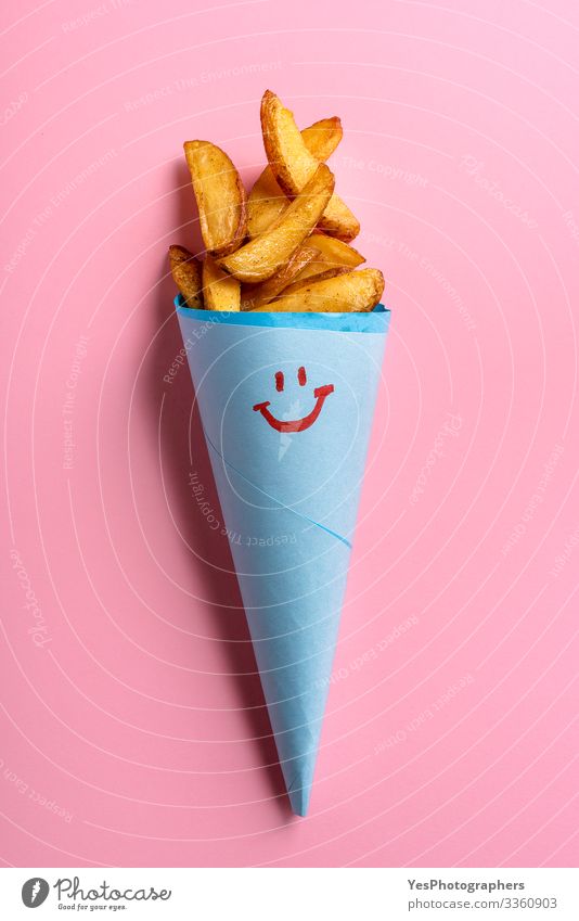 Roast potatoes in blue paper cone on pink background Food Vegetable Dinner Vegetarian diet Fast food Delicious Funny Cute Gold above view american fries